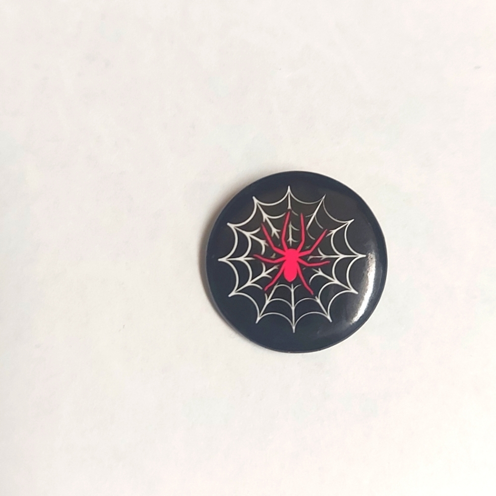 Small red and black spider web button